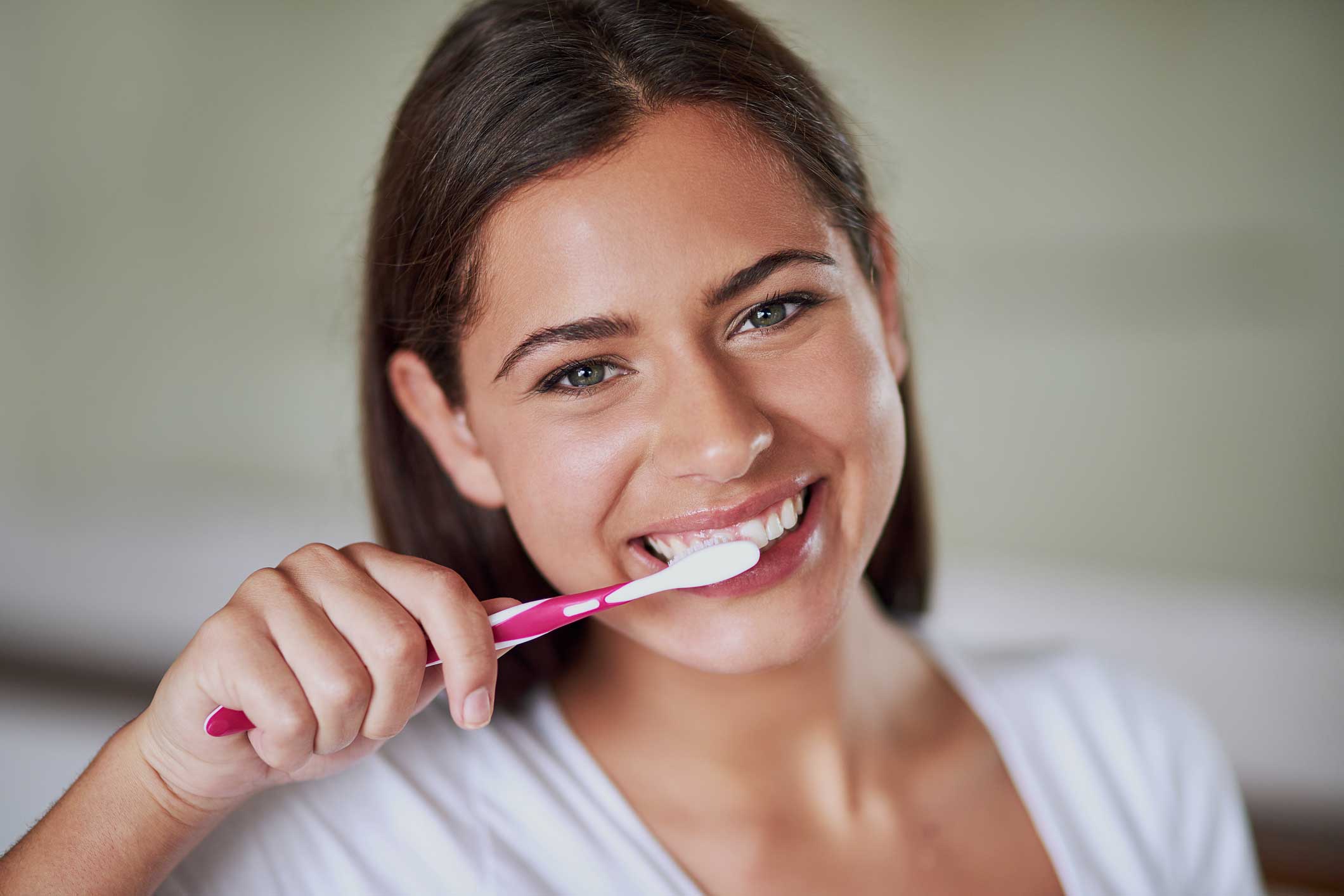 A beautiful lady brushing her teeth
